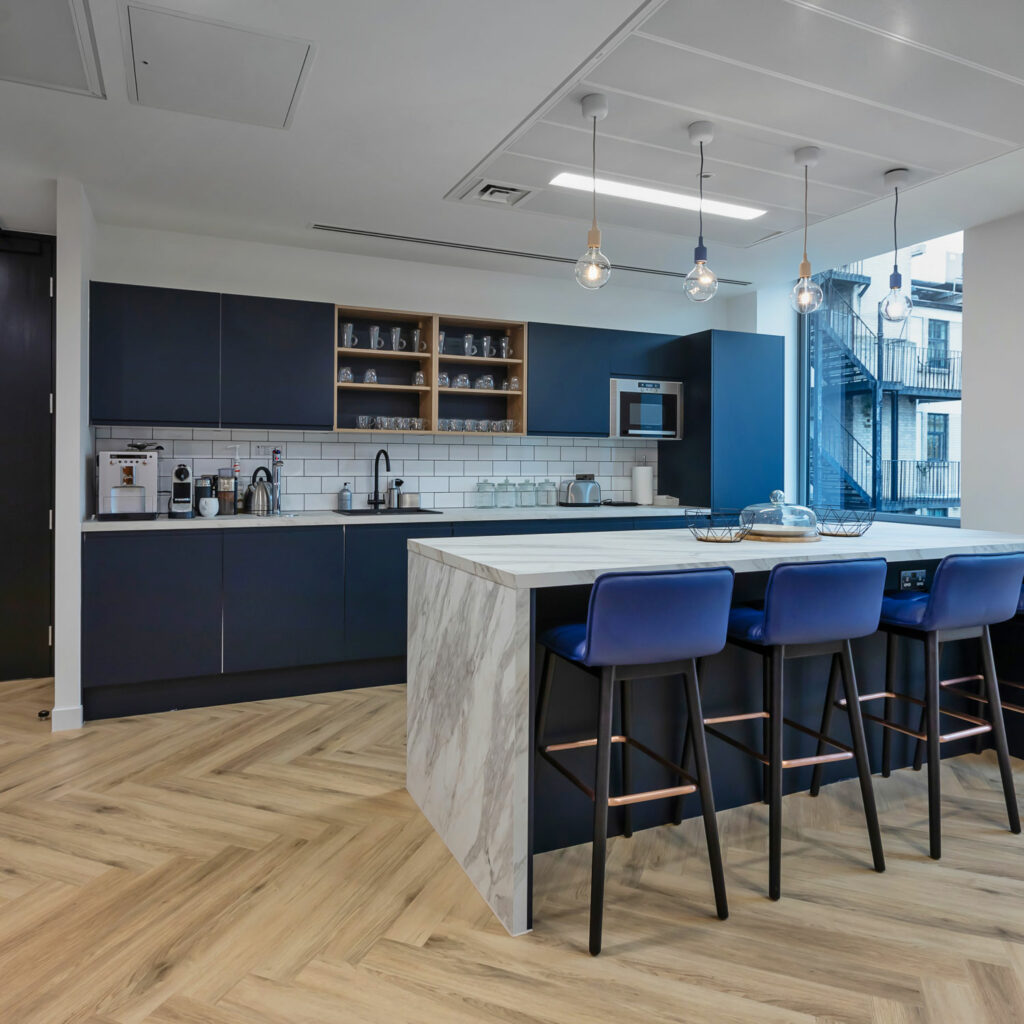 Blue and Marble kitchen created by office refurbishment company Arke