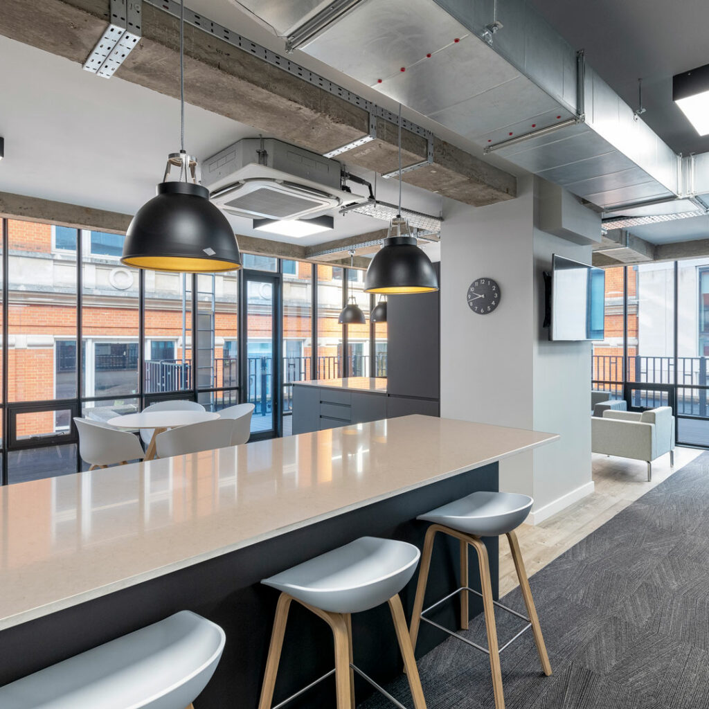 Grey breakfast bar with seating designed by Arke in square format